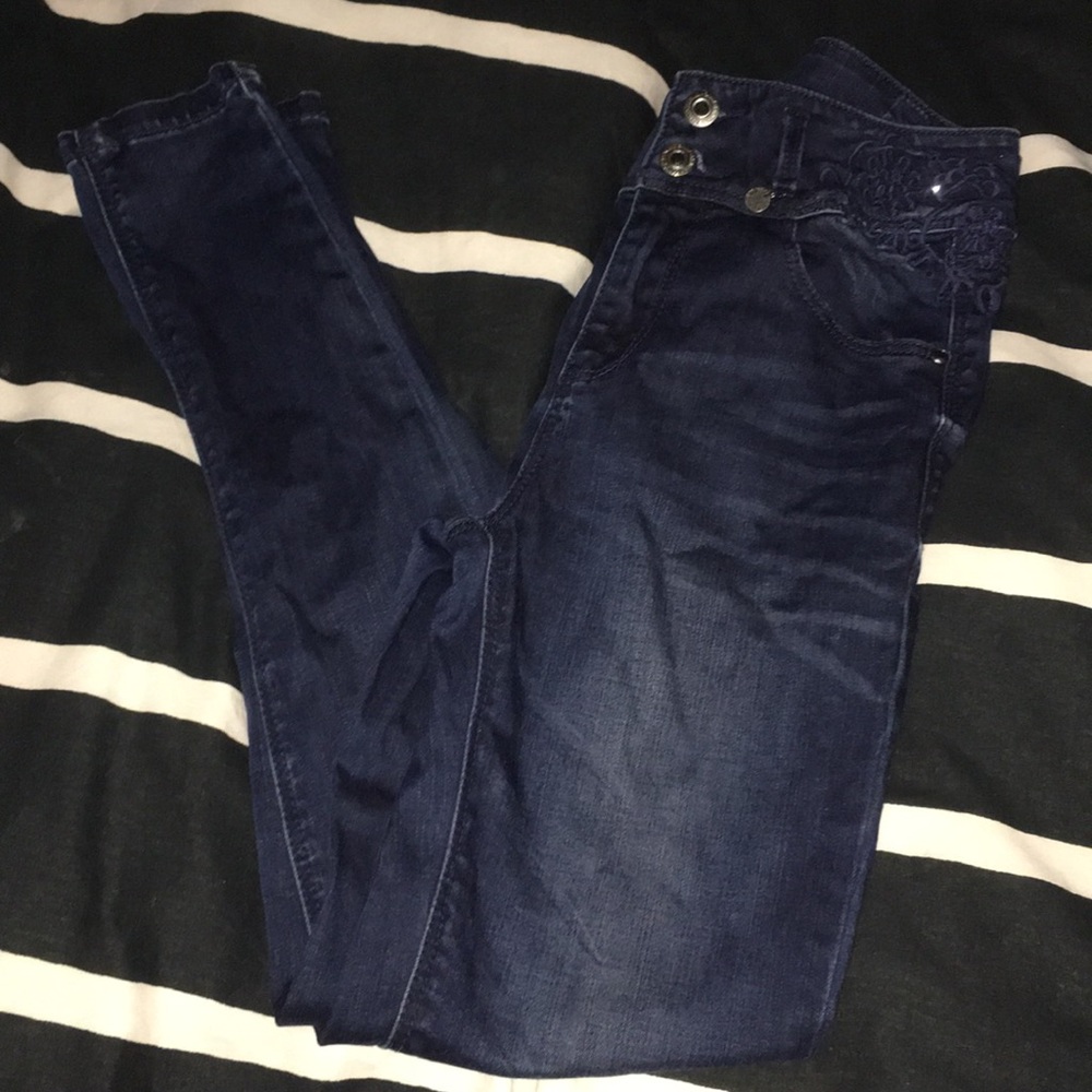 Ankle length dark blue skinny jeans with rhinestones and floral embroidery